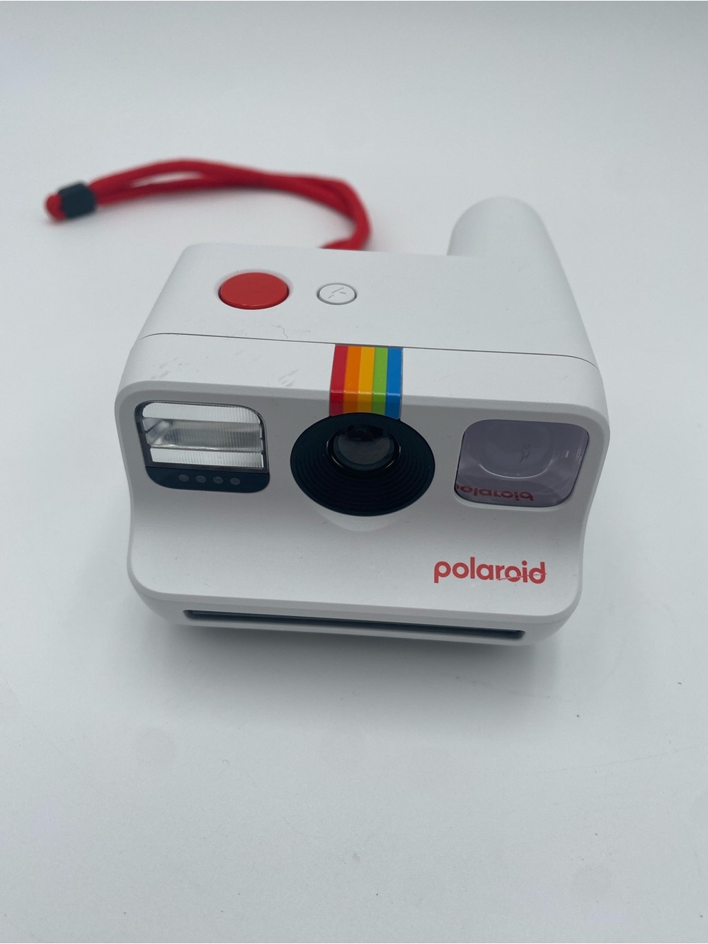 Polaroid White Instant Camera with Red Accent and Rainbow Stripe
